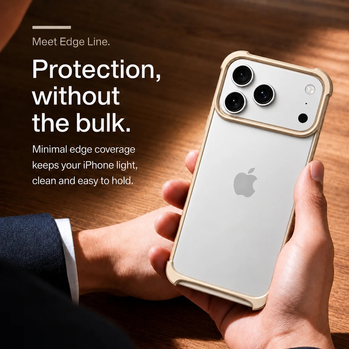 Champagne gold open metal bumper phone case held above a wooden desk #color_Champagne Gold