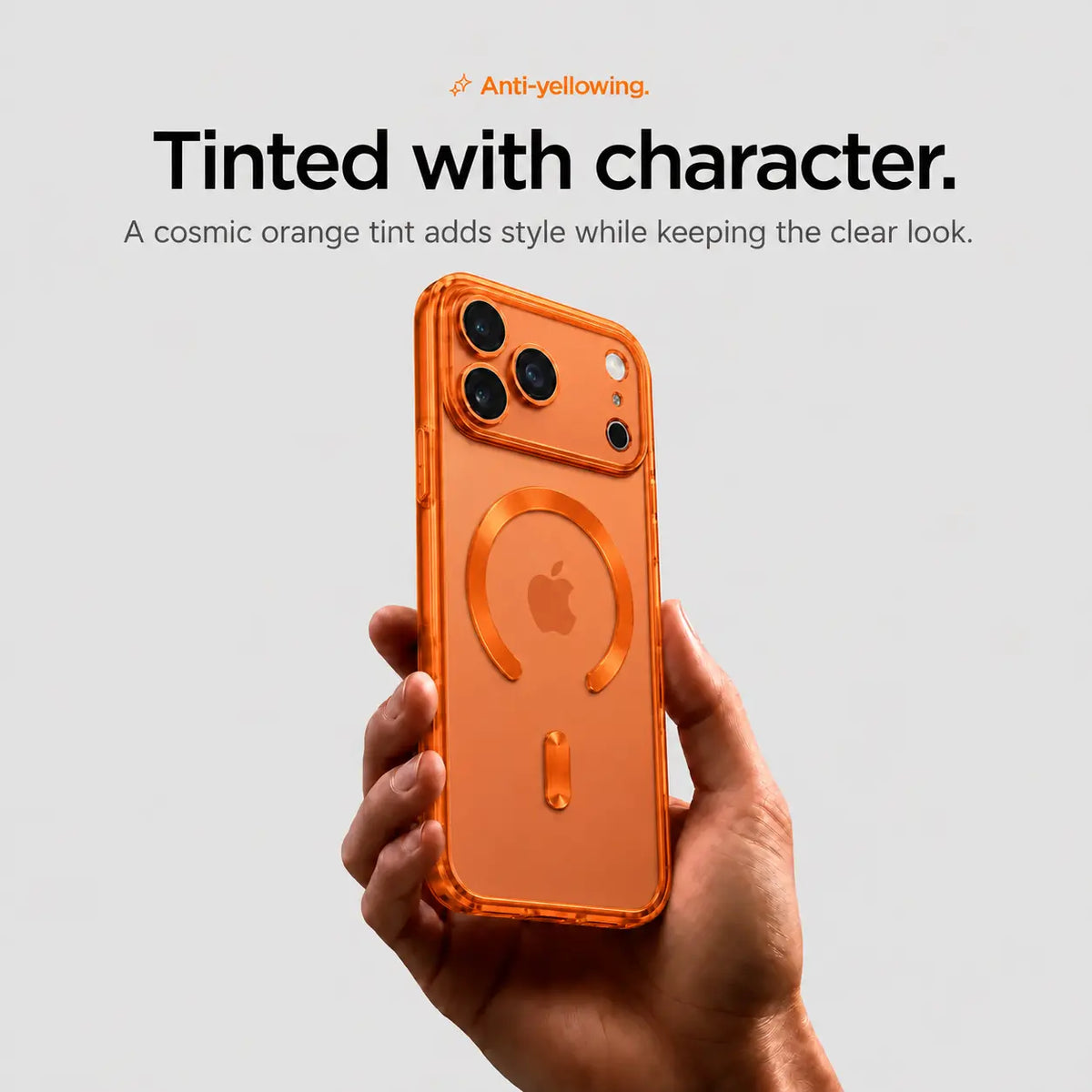 Orange tinted magnetic phone case held upright in one hand #color_Cosmic Orange