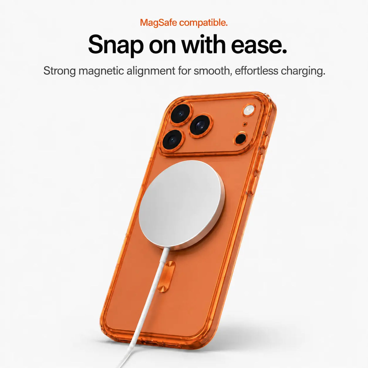 Orange tinted phone case attached to a white magnetic wireless charging puck #color_Cosmic Orange