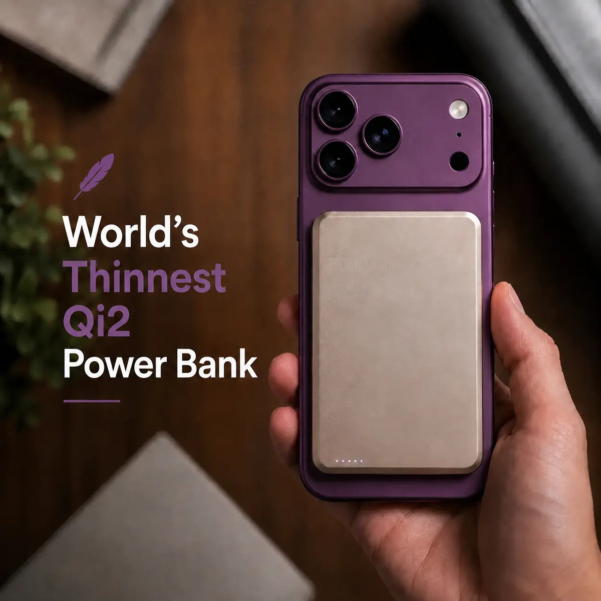 Titanium Stone Gray slim magnetic power bank held on a Burgundy phone. #color_Titanium Stone Gray