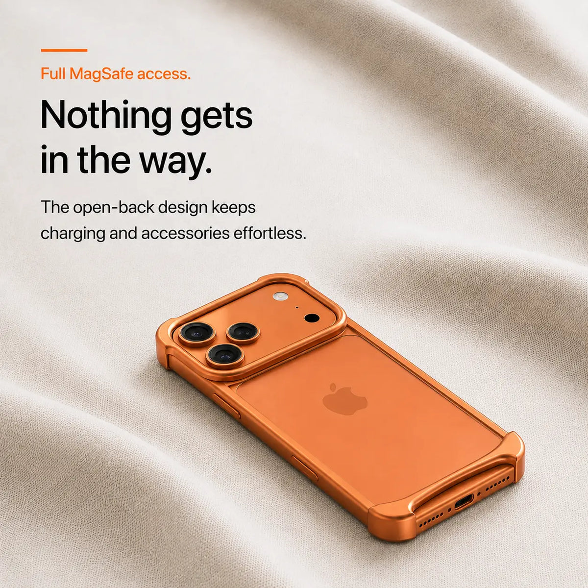 Orange open-back bumper phone case resting on light fabric #color_Cosmic Orange