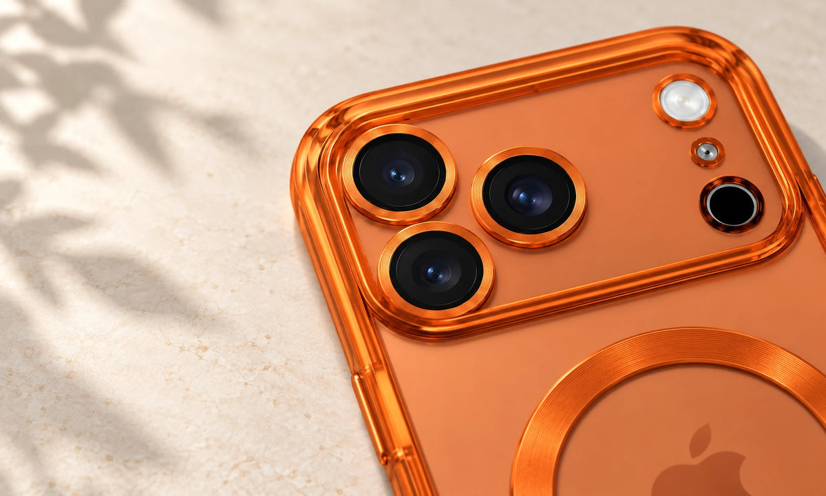 Raised transparent orange camera frame surrounding three rear phone lenses.