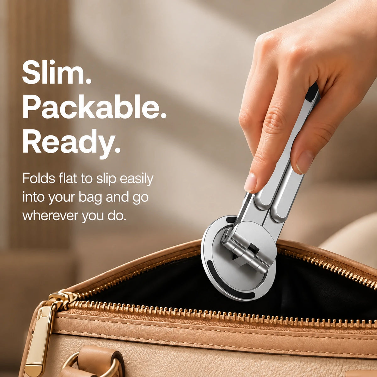 Titanium Silver folding magnetic device stand folded into a travel bag #color_Titanium Silver